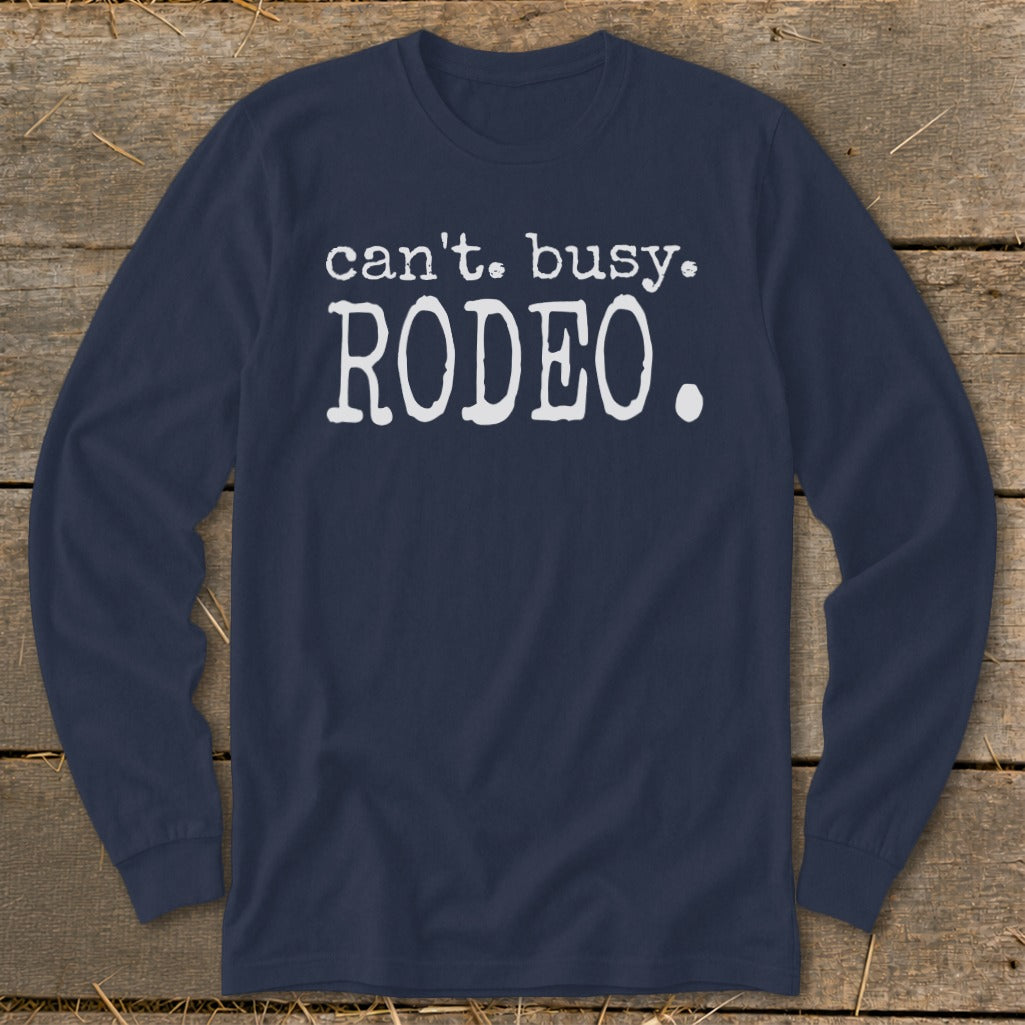 Navy long-sleeve shirt with white text that says "can't. busy. RODEO."
