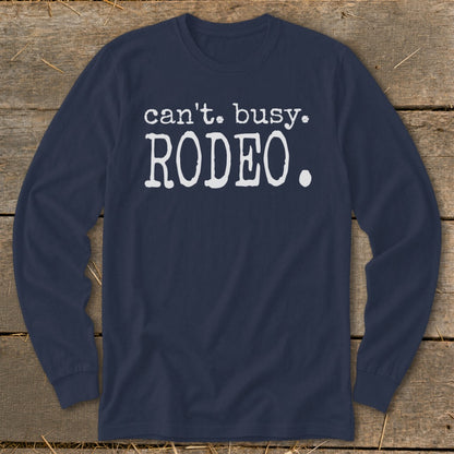 Navy long-sleeve shirt with white text that says "can't. busy. RODEO."