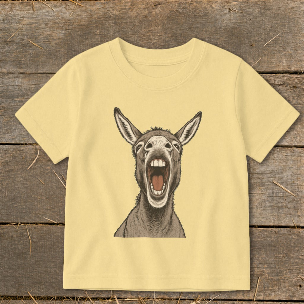 Yellow t-shirt with a drawing of a donkey with its mouth wide open.