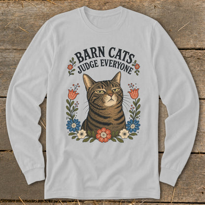 Light gray long sleeve shirt with a tabby cat surrounded by flowers and text "BARN CATS JUDGE EVERYONE."