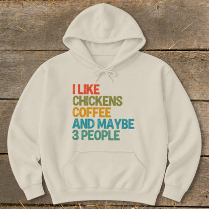 Cream hoodie with text "I LIKE CHICKENS COFFEE AND MAYBE 3 PEOPLE".