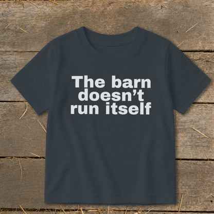 Dark t-shirt with white text: "The barn doesn't run itself"