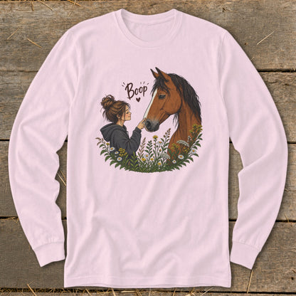 Illustration of a girl touching a horse's nose, with "Boop" text and flowers.