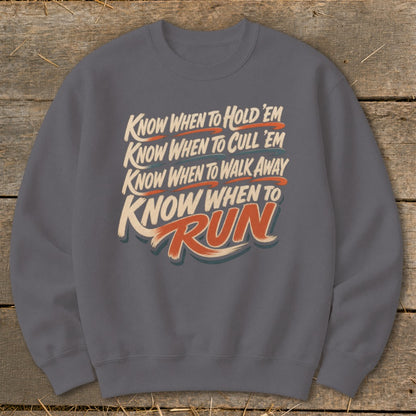 Dark gray sweatshirt with text: Know When To Hold 'Em, Cull 'Em, Walk Away, Run.