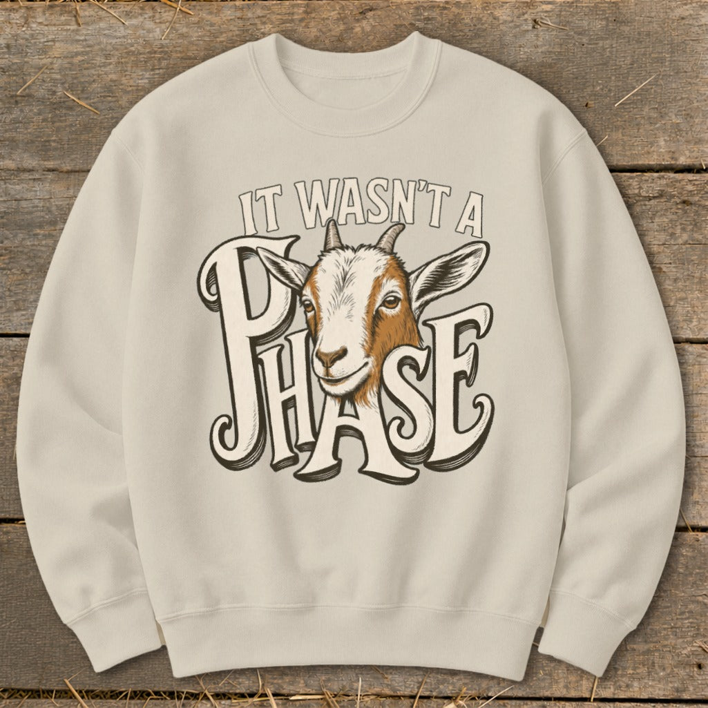 Crewneck sweatshirt with a goat peeking through text that reads "IT WASN'T A PHASE."