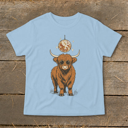 Highland cow with sunglasses and disco ball on light blue t-shirt.