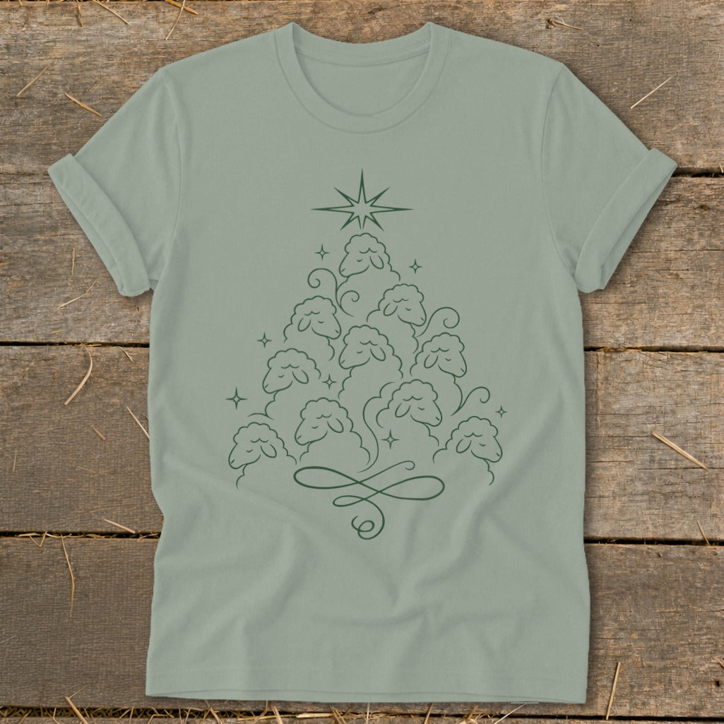 Green t-shirt with a Christmas tree made of sheep and a star.