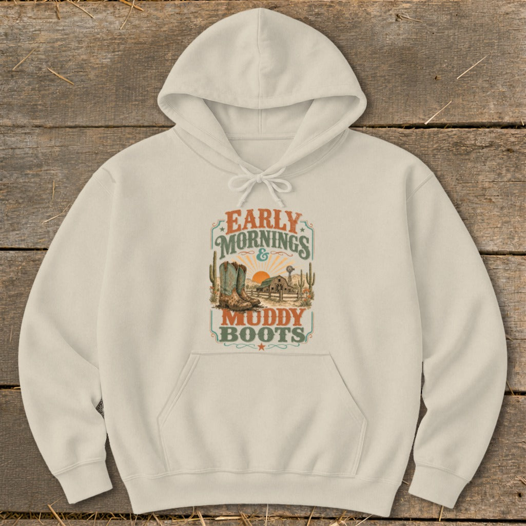 Cream hoodie with "Early Mornings & Muddy Boots" graphic featuring cowboy boots and a farm scene.