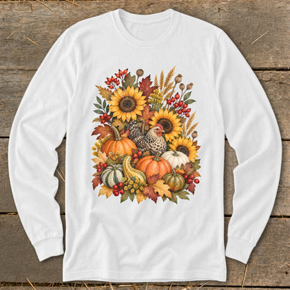 White long-sleeve shirt featuring a watercolor illustration of a chicken and autumn harvest elements.