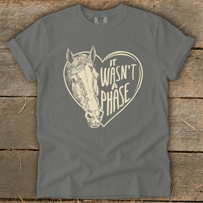 Grey t-shirt with a horse head inside a heart graphic that reads "It Wasn't A Phase".