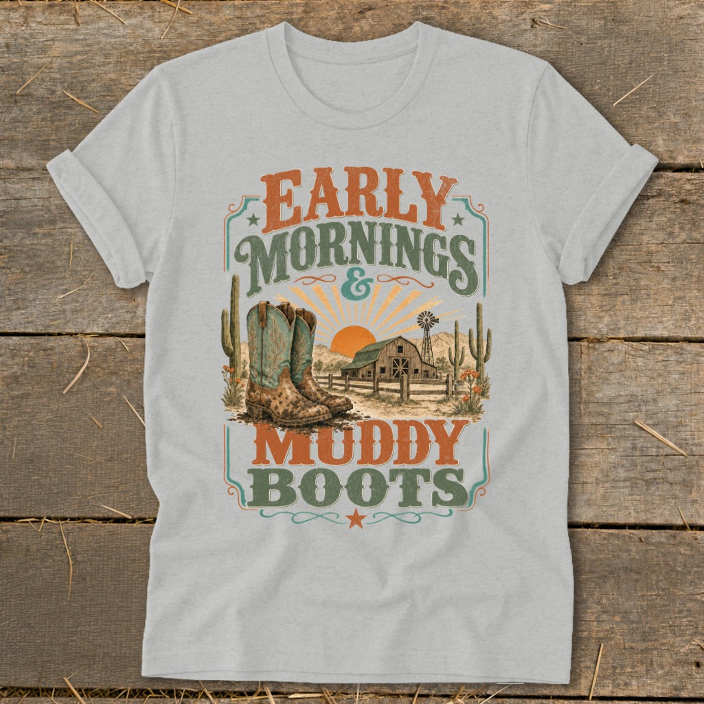 Grey t-shirt with "Early Mornings & Muddy Boots" text, cowboy boots, and barn scene.