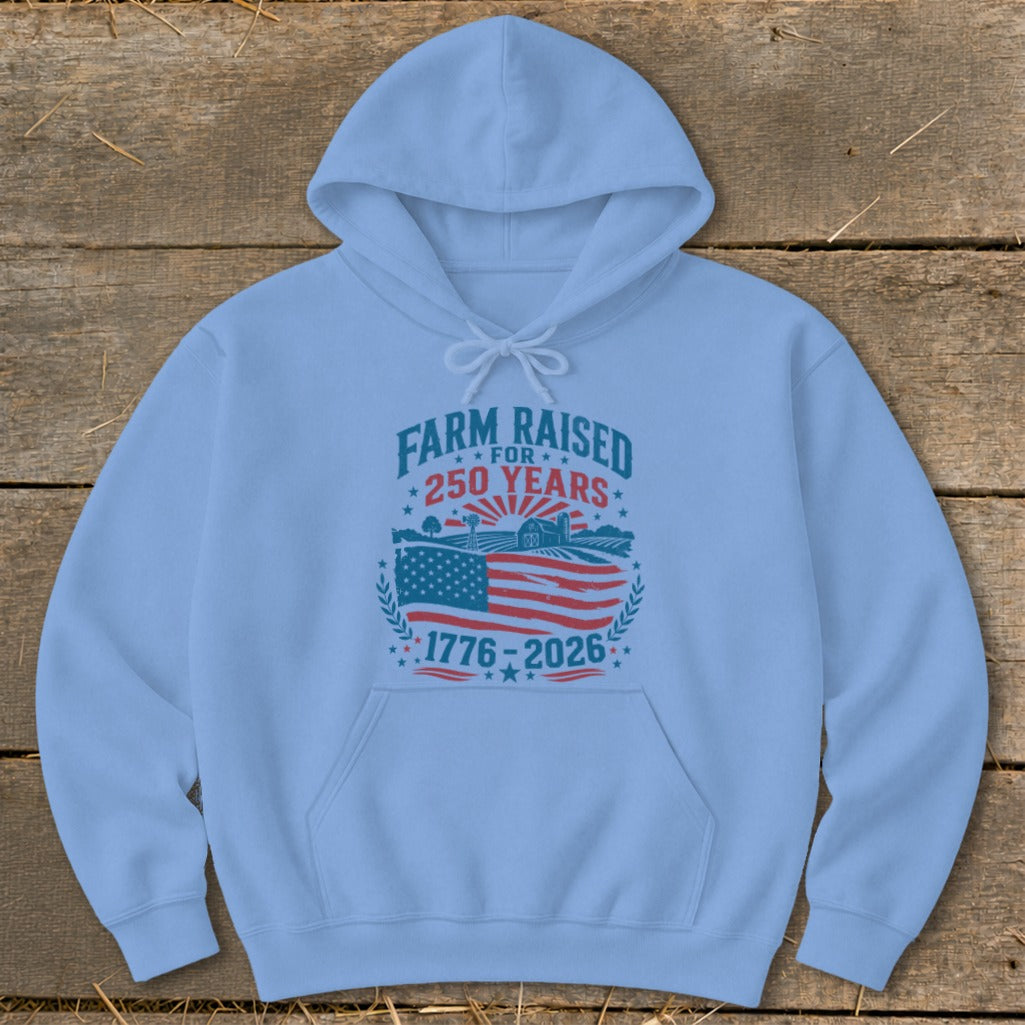 Light blue hoodie with "Farm Raised for 250 Years" and 1776-2026 design.
