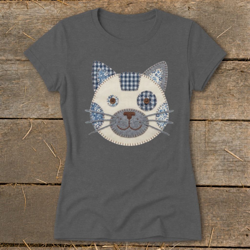 Gray t-shirt with a patchwork cat face applique featuring blue and white patterns.