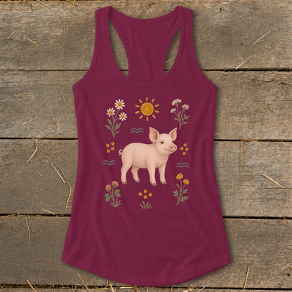 Burgundy tank top with a pig illustration surrounded by flowers, sun, and waves.