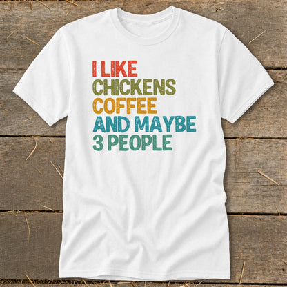 White t-shirt with "I like chickens, coffee and maybe 3 people" text.