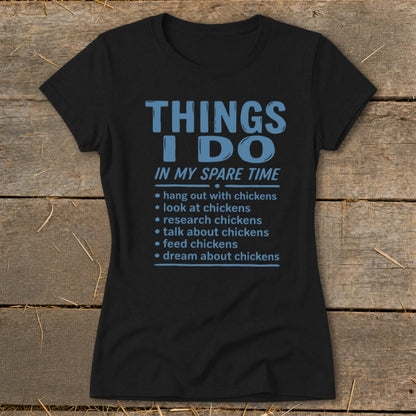 Black t-shirt with blue text listing chicken-related activities.