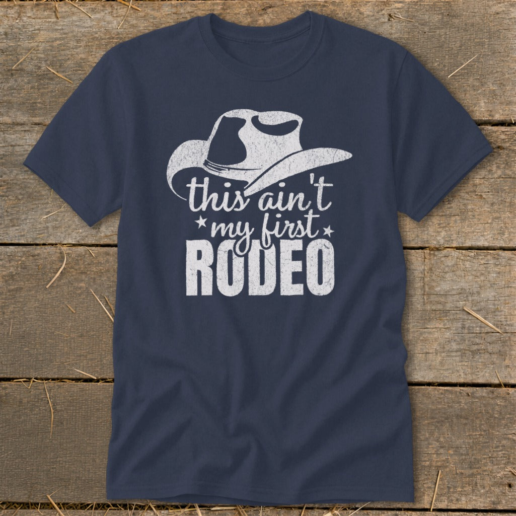 Navy t-shirt with a white cowboy hat graphic and the text "this ain't *my first* RODEO".
