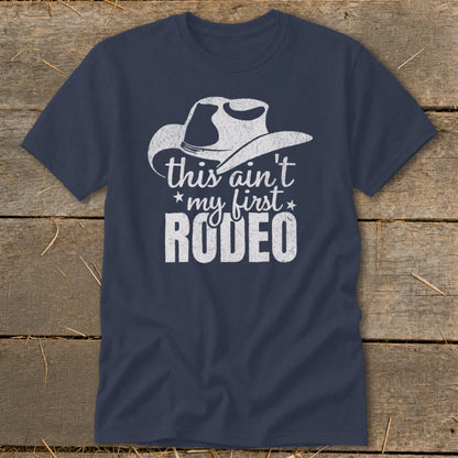 Navy t-shirt with a white cowboy hat graphic and the text "this ain't *my first* RODEO".