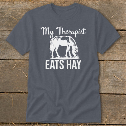 Dark gray t-shirt with white graphic of a horse eating hay and text "My Therapist Eats Hay".