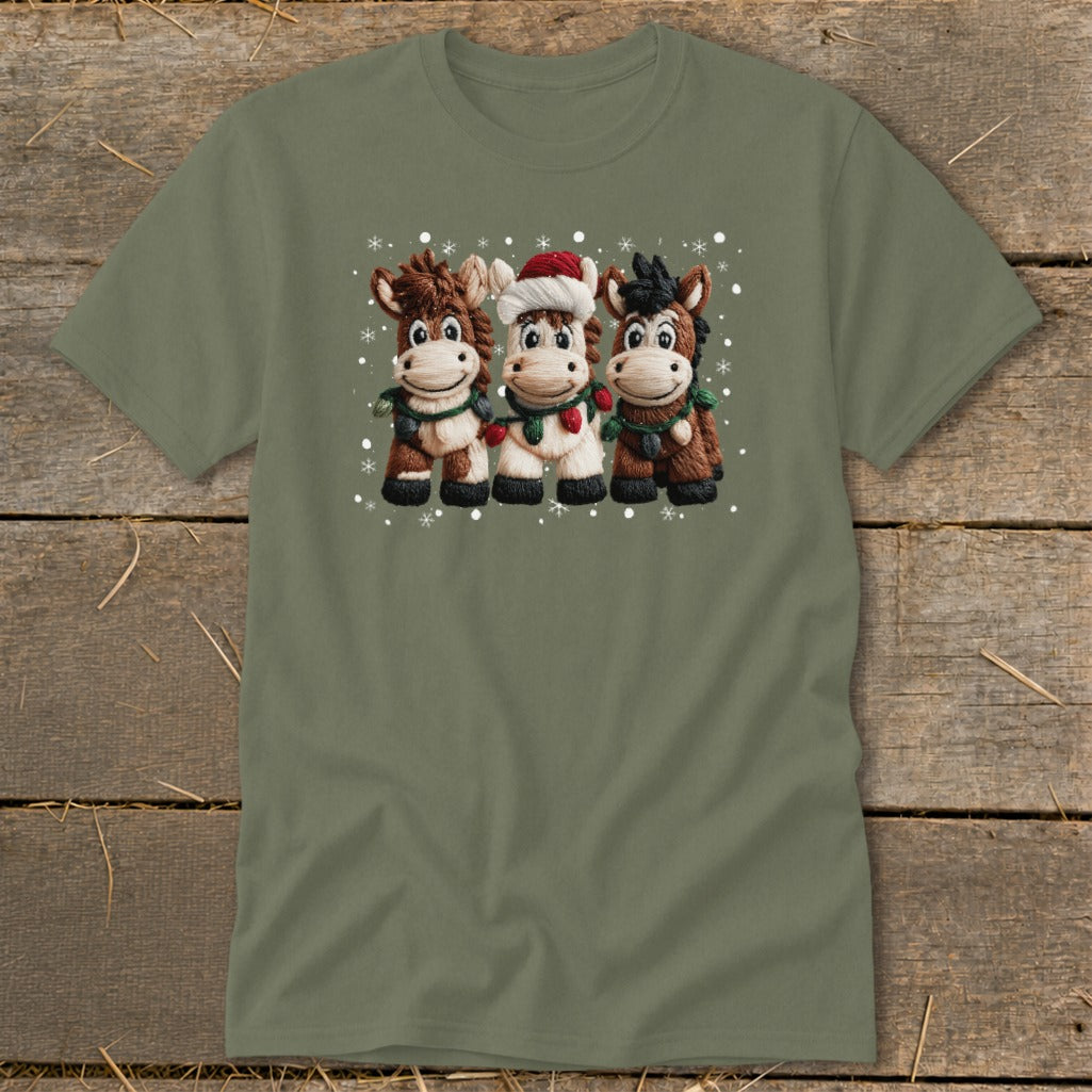 Three cartoon horses wearing Santa hats and Christmas lights, with snowflakes.