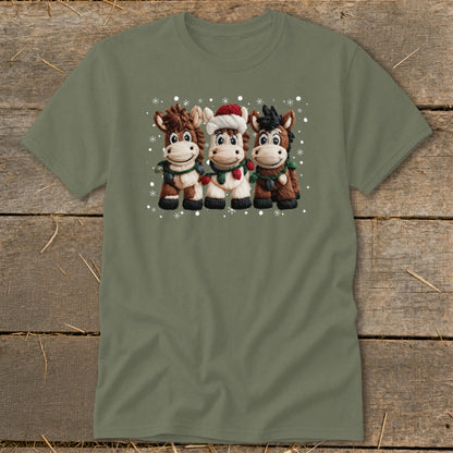 Three cartoon horses wearing Santa hats and Christmas lights, with snowflakes.