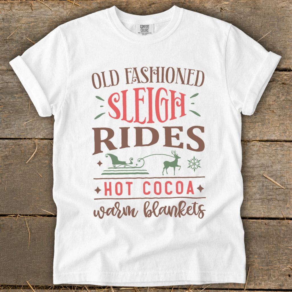 White t-shirt with text "Old Fashioned Sleigh Rides Hot Cocoa Warm Blankets."