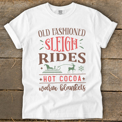 White t-shirt with text "Old Fashioned Sleigh Rides Hot Cocoa Warm Blankets."