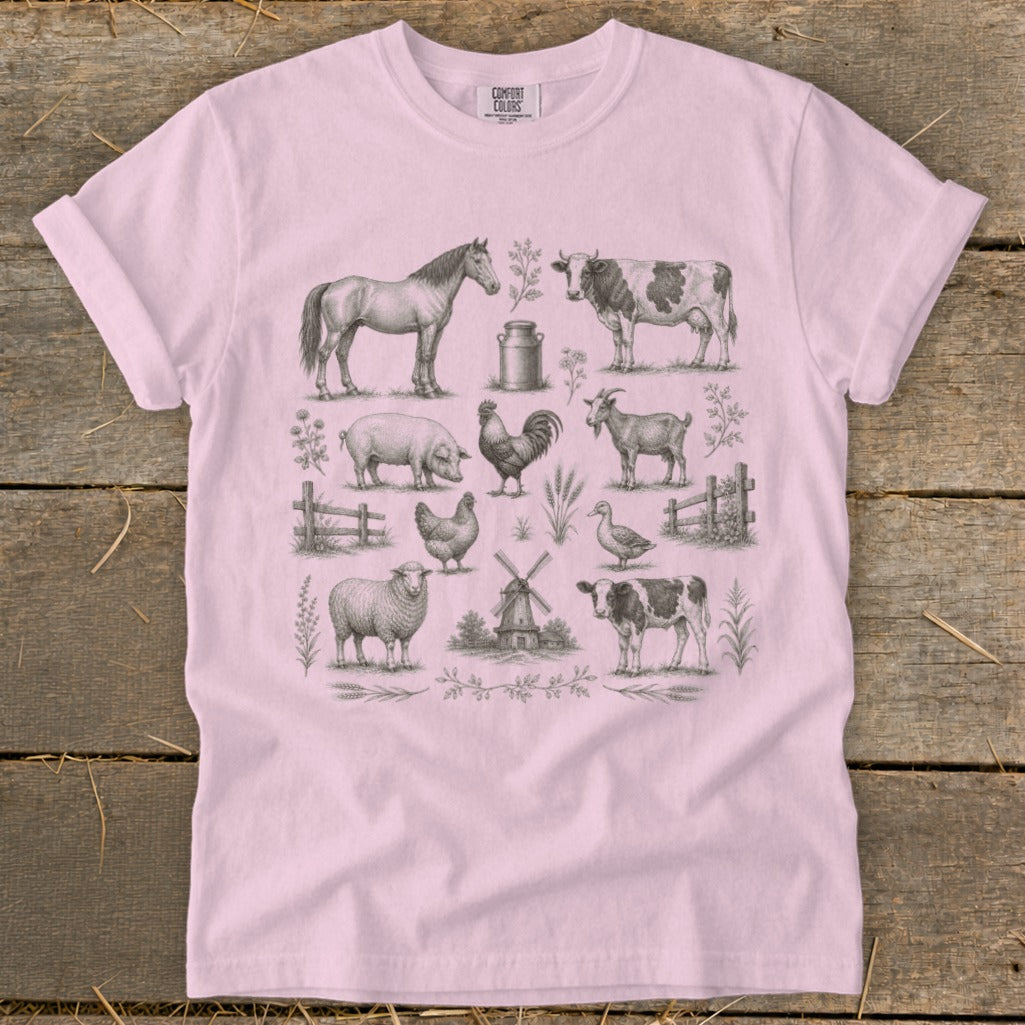 Pink t-shirt with a charcoal sketch of farm animals and a windmill.