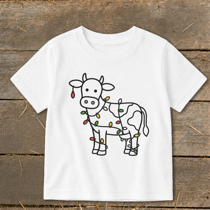 White t-shirt with cartoon cow wrapped in colorful Christmas lights.