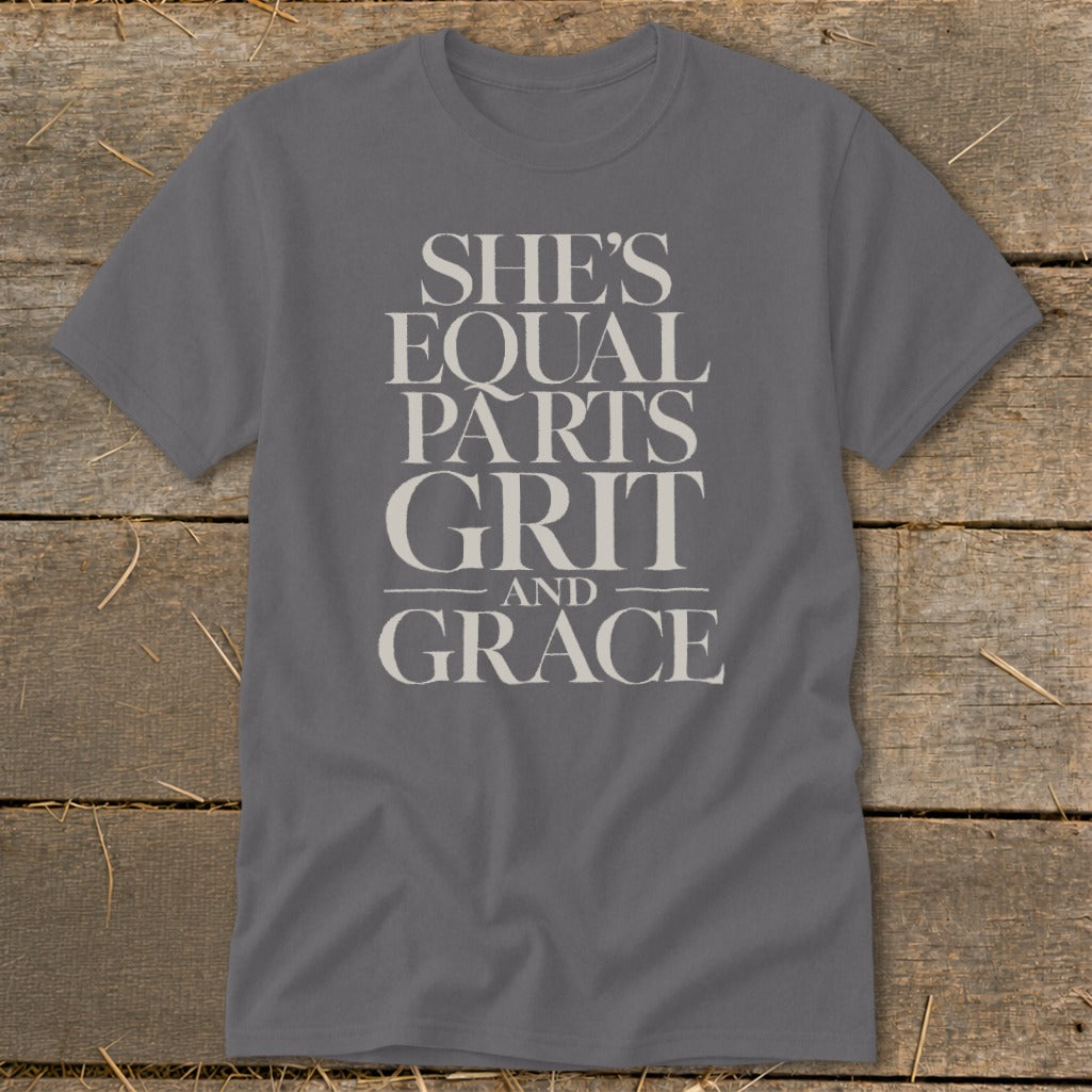 Gray t-shirt with text "She's Equal Parts Grit and Grace" in beige.