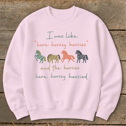 Pink sweatshirt with horses and text: "I was like 'here horsey horsies' and the horsies here horsey horsied"