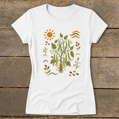 White t-shirt with a green pea plant illustration and sun graphic.