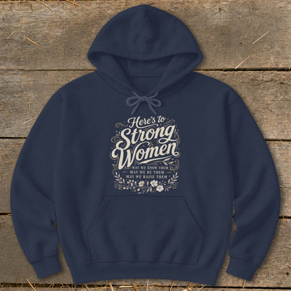 Navy hoodie with text "Here's to Strong Women. May we know them, may we be them, may we raise them."