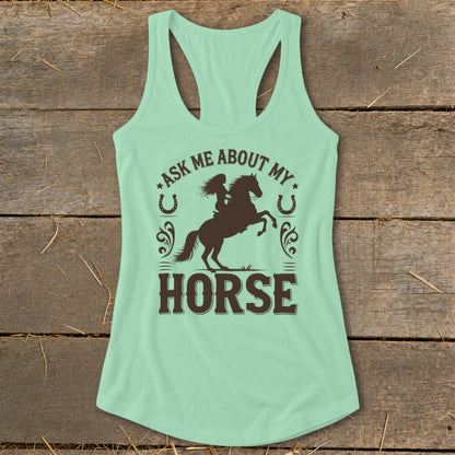 Tank top with brown graphic of a rider on a rearing horse and text.