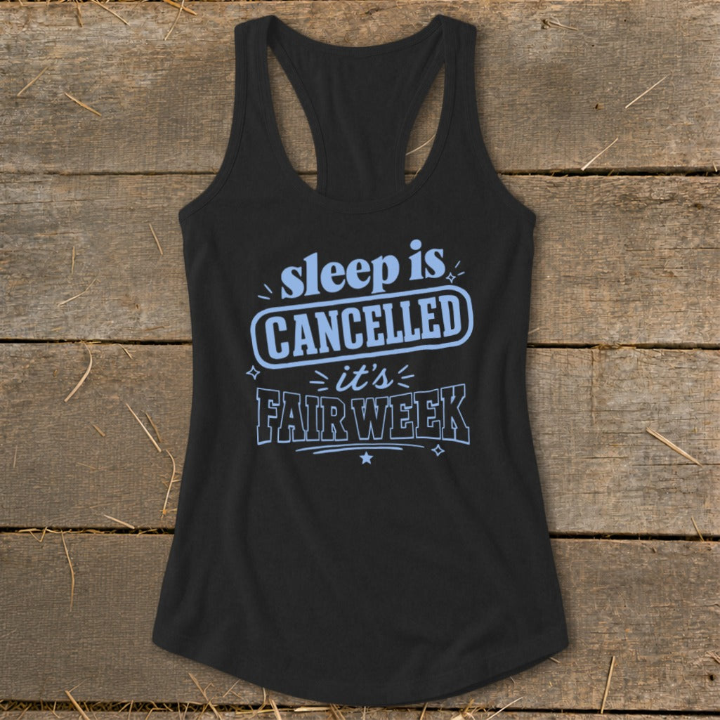 Black tank top with "sleep is CANCELLED =it's FAIR WEEK" text in light blue.