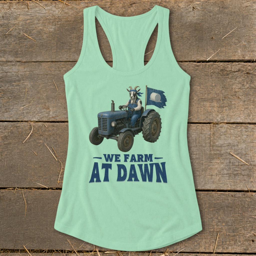 Light green tank top with goat on tractor and text "We Farm At Dawn".