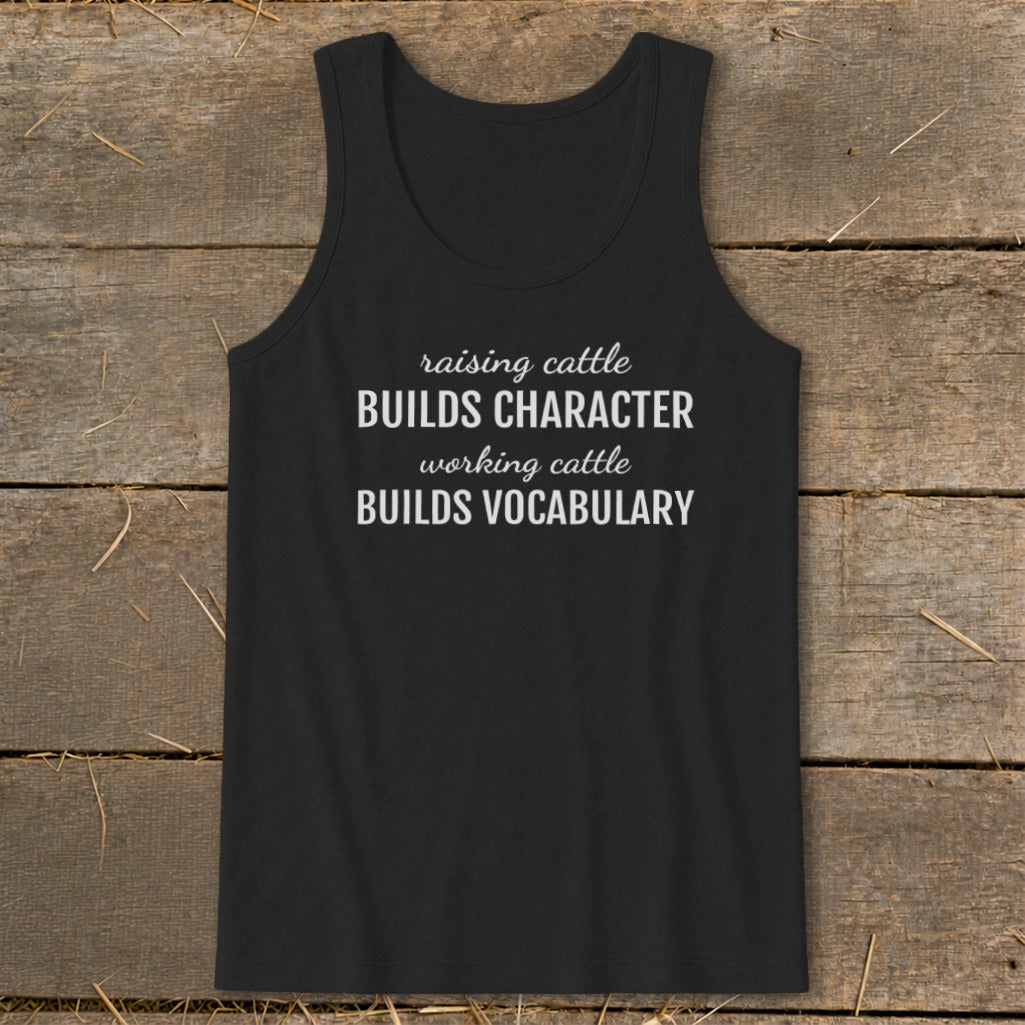 Black tank top with white text: "raising cattle BUILDS CHARACTER, working cattle BUILDS VOCABULARY."