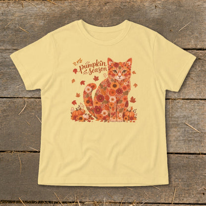 Yellow t-shirt with a floral cat and "Pumpkin Season" text surrounded by leaves.