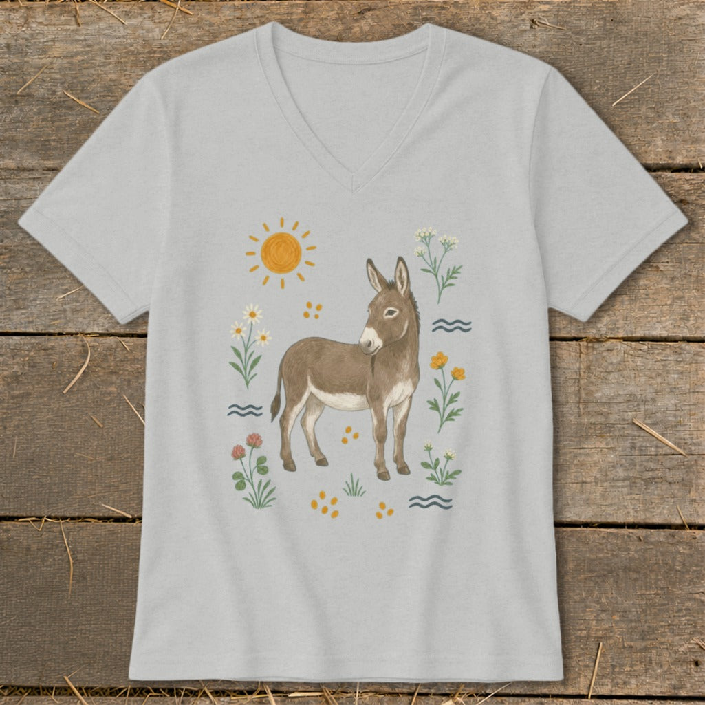 T-shirt with a watercolor illustration of a donkey surrounded by flowers and a sun.