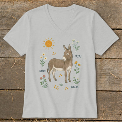 T-shirt with a watercolor illustration of a donkey surrounded by flowers and a sun.