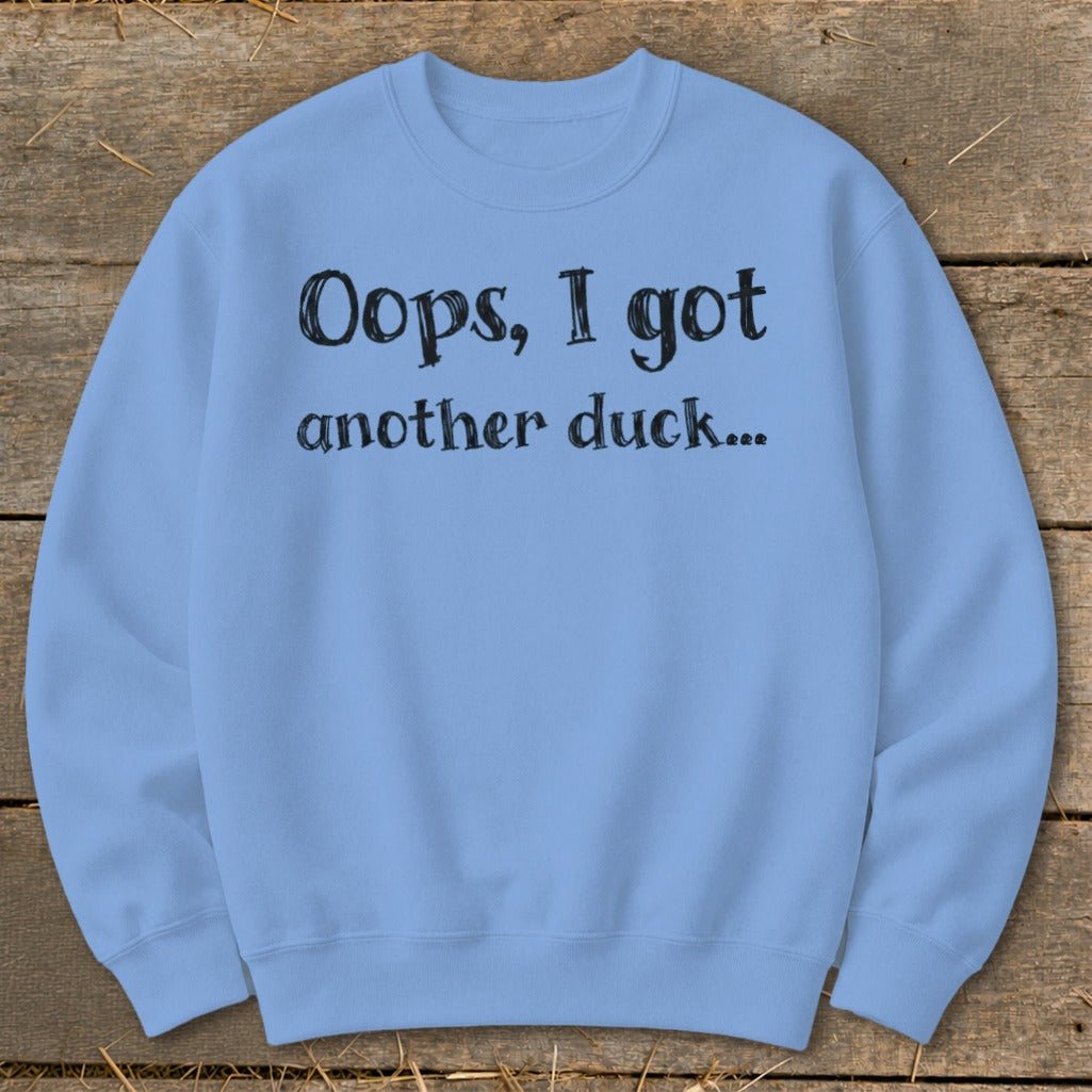 Light blue sweatshirt with black text reading "Oops, I got another duck..."