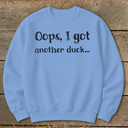 Light blue sweatshirt with black text reading "Oops, I got another duck..."