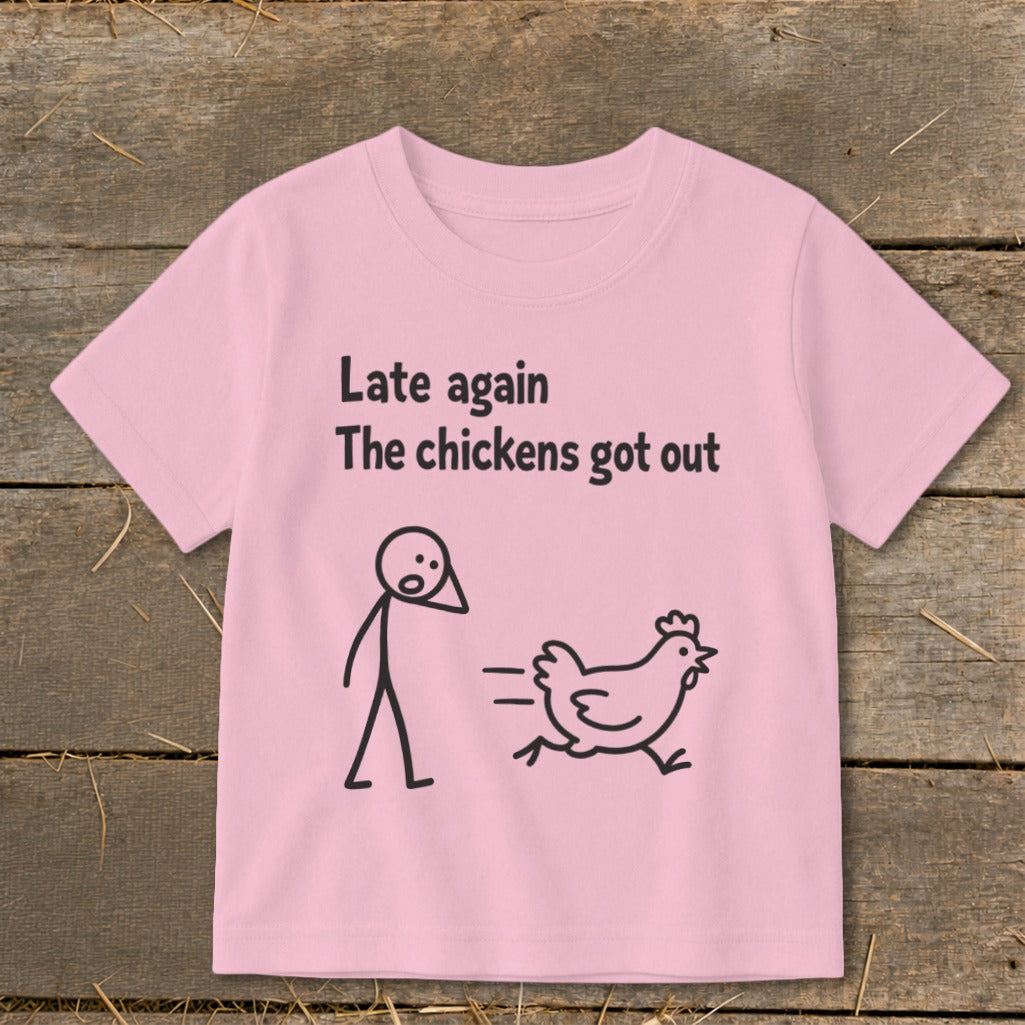 Pink t-shirt with "Late again The chickens got out" text and stick figures.