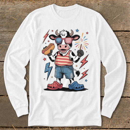 Cartoon cow wearing American flag sunglasses, holding a hot dog and a firecracker.