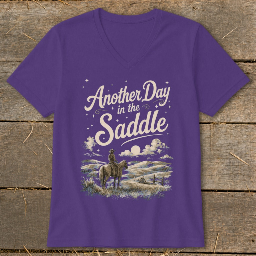 Purple t-shirt with "Another Day in the Saddle" and a cowboy on a horse.