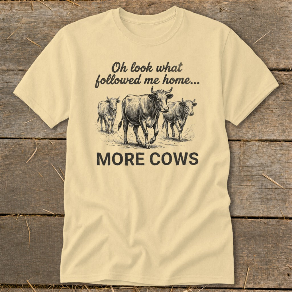 T-shirt with drawing of three cows and text "Oh look what followed me home... MORE COWS".