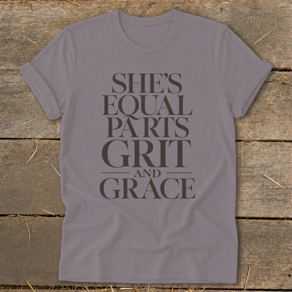 Purple t-shirt with text "SHE'S EQUAL PARTS GRIT AND GRACE".