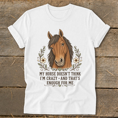 White t-shirt with horse illustration and text "MY HORSE DOESN'T THINK I'M CRAZY AND THAT'S ENOUGH FOR ME".