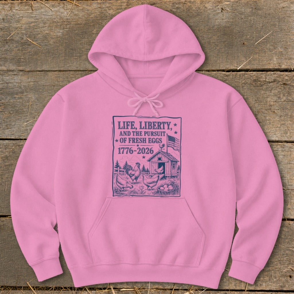 Pink hoodie with "Life, Liberty, and the Pursuit of Fresh Eggs" graphic.