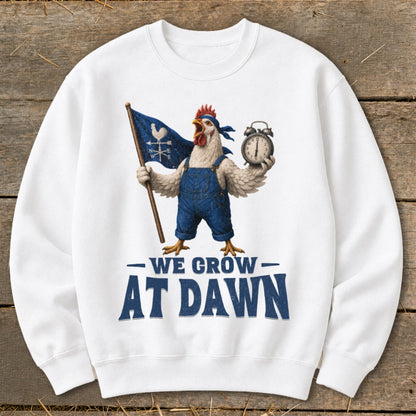 White sweatshirt with a rooster holding a flag and alarm clock, reads "We Grow At Dawn."